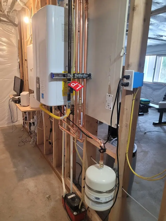 Licensed plumber repairing a kitchen sink in Fostoria